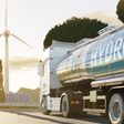 Truck on road with H2 Hydrogen logo. Renewable or sustainable electricity. Clean alternative ecological energy. 3D rendering.