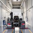 Truck in a car service for maintenance. Servicing and repairing trucks in a large garage. Car service, repair, diagnostics