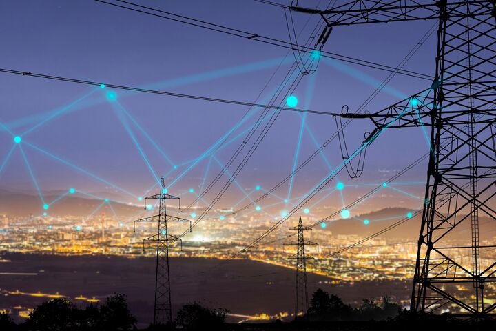High power electricity poles in urban area connected to smart grid. Energy supply, distribution of energy, transmitting energy, energy transmission, high voltage supply concept photo.