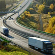 truck, trucking, lorry, trailer, car, vehicle, automobile, freight, haulage, transport, traffic, transit, transportation, logistic, cargo, delivery, conveyance, drive, ride, highway, freeway, expressway, motorway, road, infrastructure, turn, curve, bend, bridge, electronic toll gate, toll, autumn, fall, landscape, countryside, nature, top view, meadow, green, golden, orange, yellow, tree, wood, forest, deciduous, hill, slope, uphill, downhill truck trucking lorry trailer car vehicle automobile freight haulage transport traffic transit transportation logistic cargo delivery conveyance drive ride highway freeway expressway motorway road infrastructure turn curve bend bridge electronic toll gate toll autumn fall landscape countryside nature top view meadow green golden orange yellow tree wood forest deciduous hill slope uphill downhill