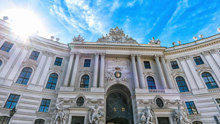 © mila103 - stock.adobe.com vienna palace austria architecture europe hofburg city tourism landmark building historic sightseeing travel facade habsburg entrance monument dome exterior old imperial town wien ancient austrian sculpture baroque square urban gate michaeler platz capital castle day european tourist white cupola residence royal sky summer historical history statue carriage attraction blue gothic people vienna palace austria architecture europe hofburg city tourism landmark building historic sightseeing travel facade habsburg entrance monument dome exterior old imperial town wien ancient austrian sculpture baroque square urban gate michaeler platz capital castle day european tourist white cupola residence royal sky summer historical history statue carriage attraction blue gothic people