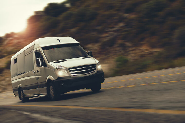 a rent bus is drive by highway